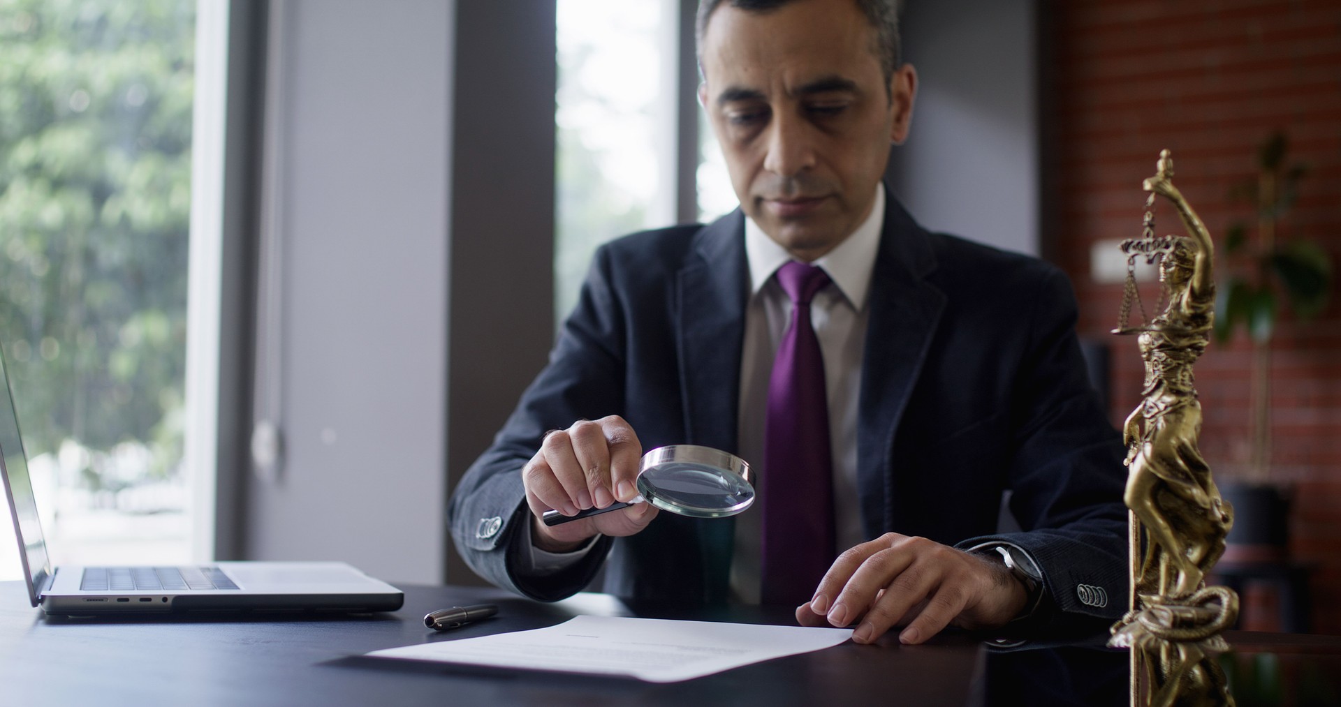 Judge or Legal advisor lawyer examining and signing legal documents.